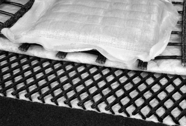 White nonwoven fabric material on a black background