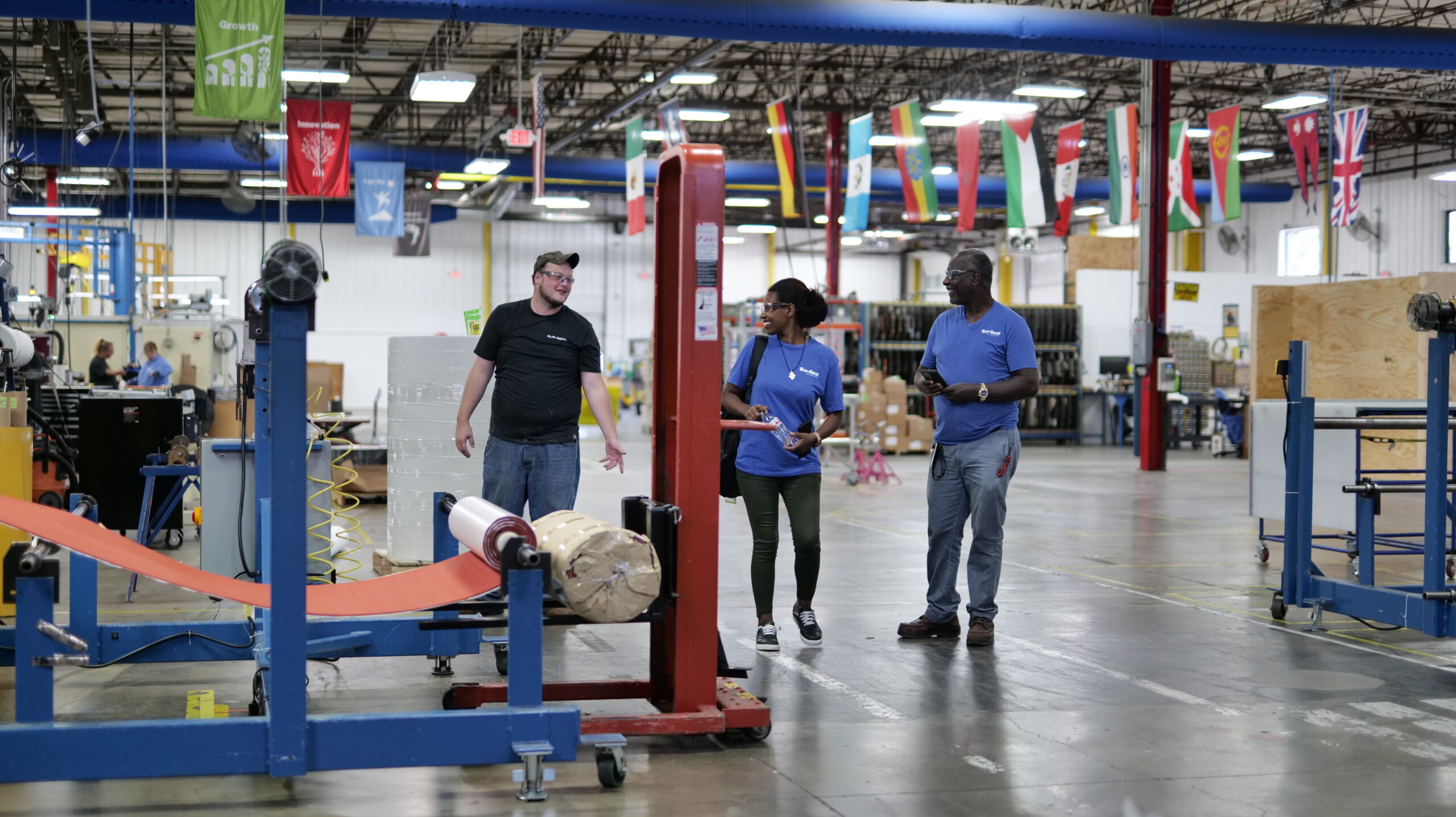 Three smiling Sur-Seal employees on site