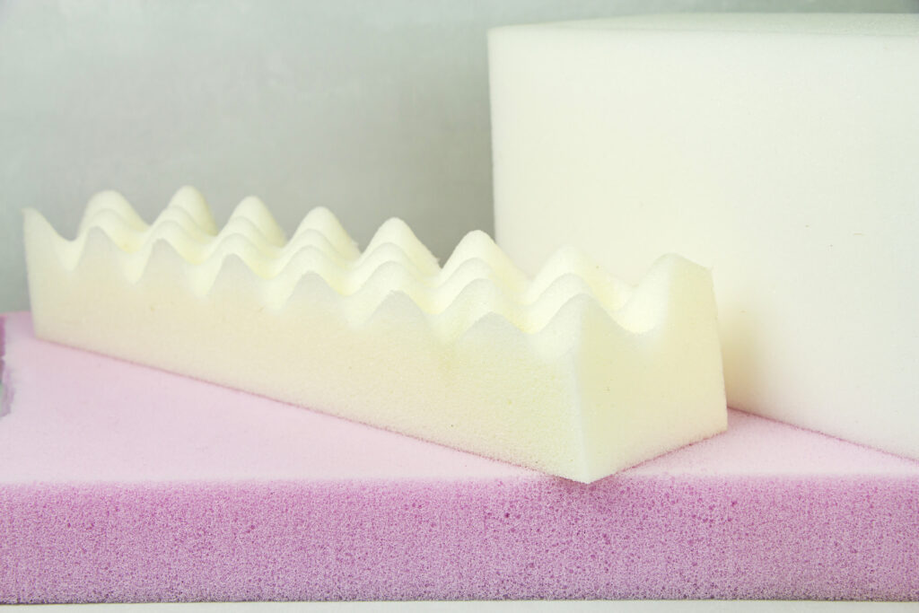 White open-cell sponge mattress material close-up
