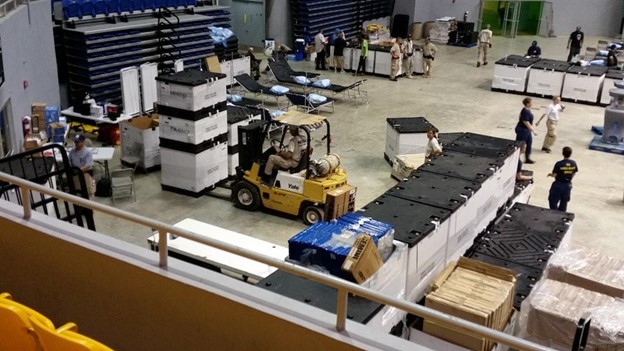 Person driving heavy machinery around a foam factory