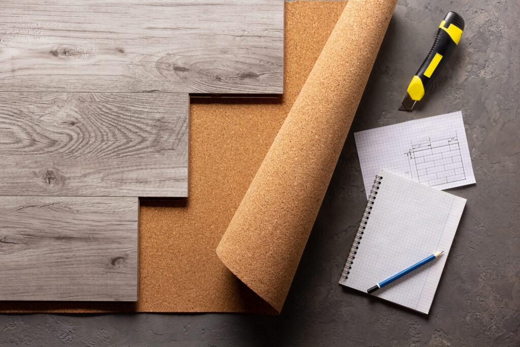 Wood laminate and cork at cement floor